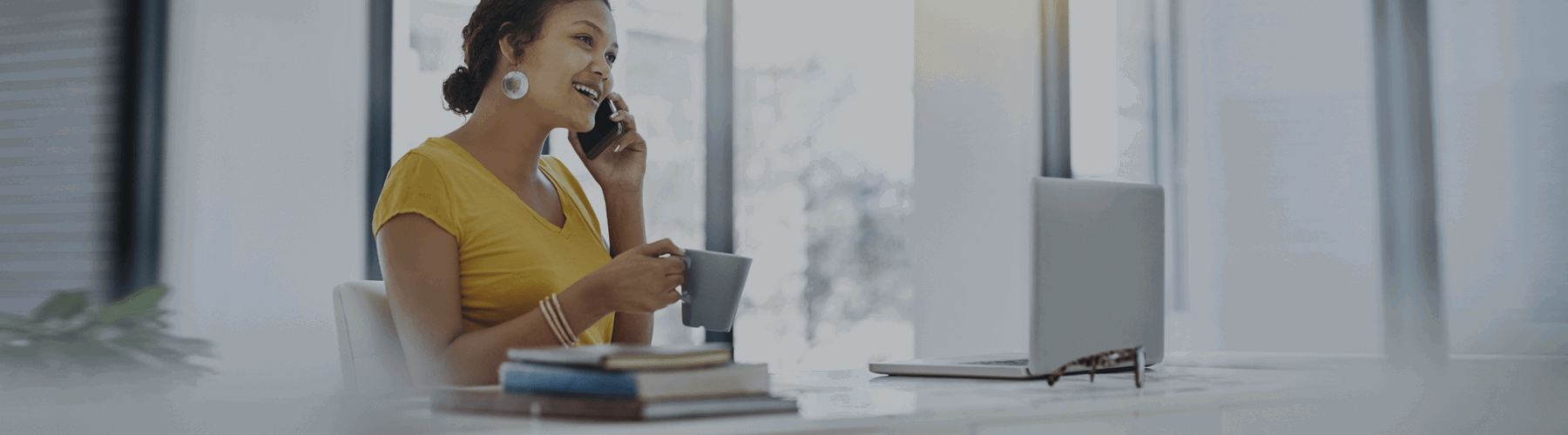 Woman at desk with coffee